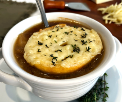 bowl of soup topped with cheese