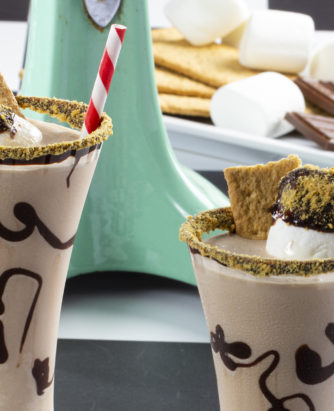 Two s'mores milkshakes sitting in display