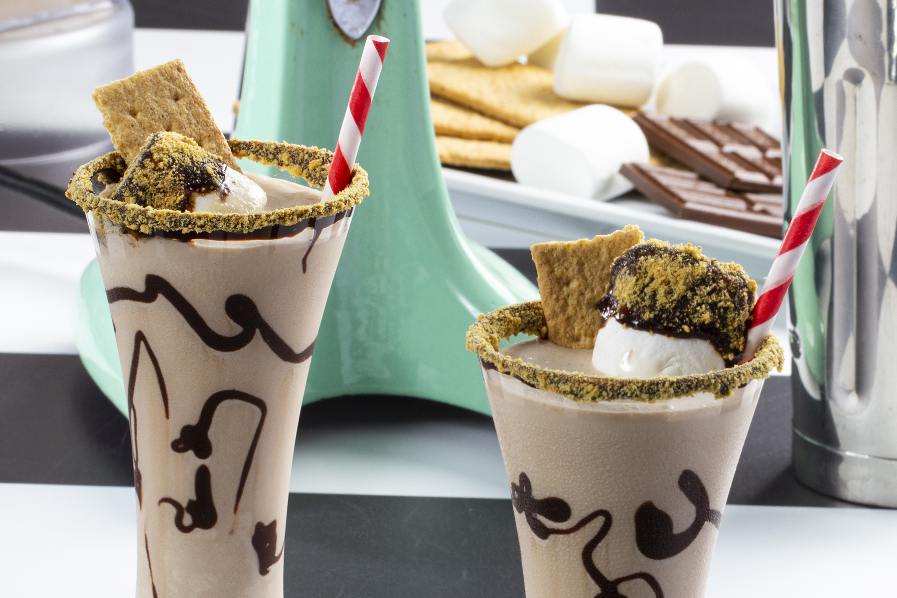 Two s'mores milkshakes sitting in display