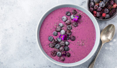 delicious blueberry smoothie bowl with frozen berries