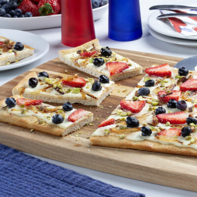 sliced flatbread on top of a wooden cutting board