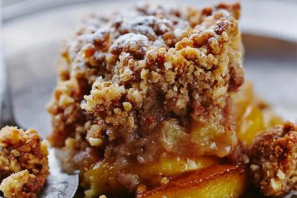 a close up of a slice of apple crumble