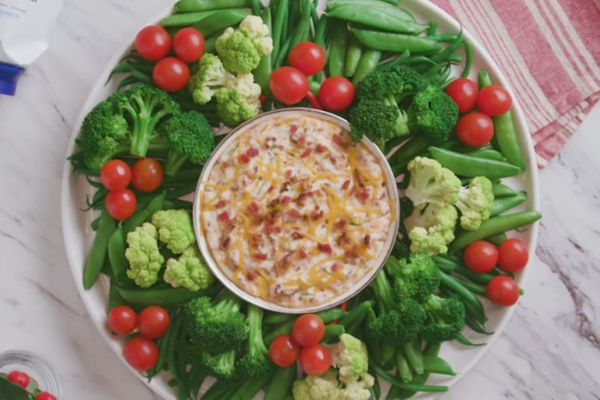 Circular Vegetable platter with a bowl of dip in the center
