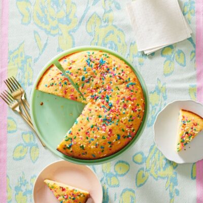 Overview shot of Birthday Snacking Cake with two slices cut out and placed on plates