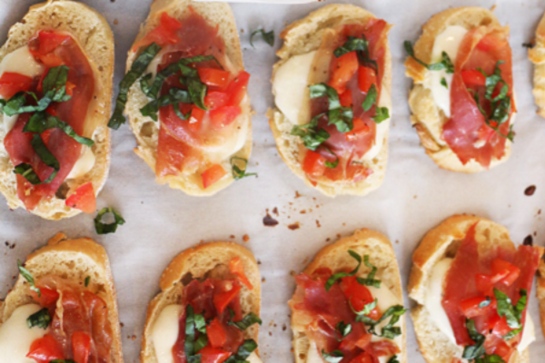 Mini toasted bread topped with bruschetta
