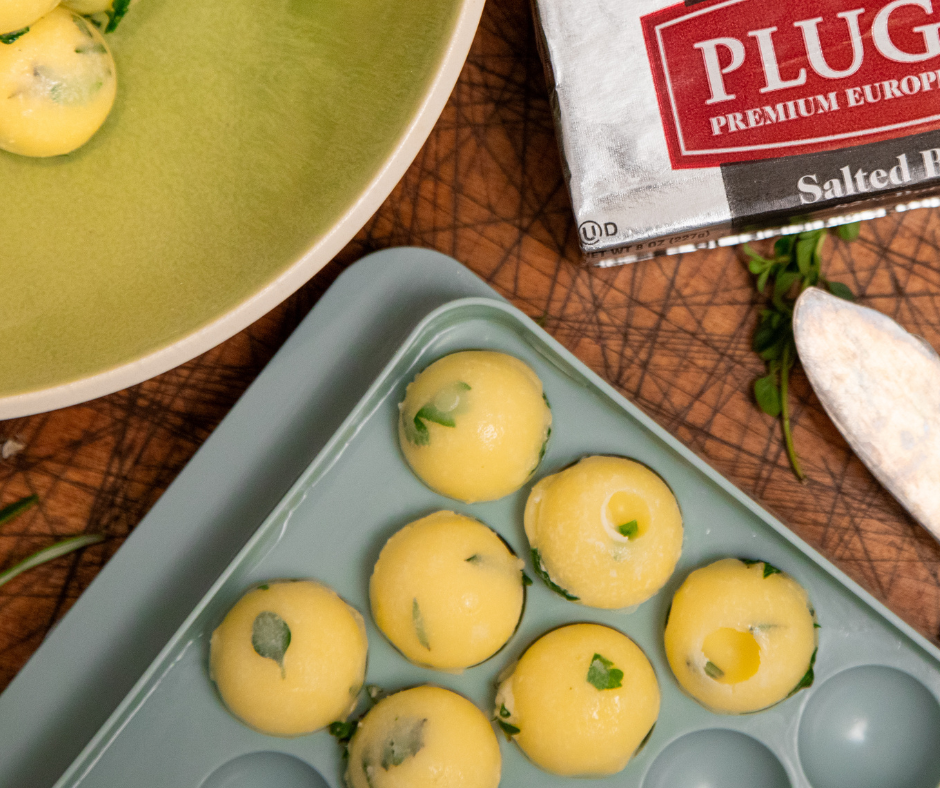 Balls of herb infused butter in an ice tray