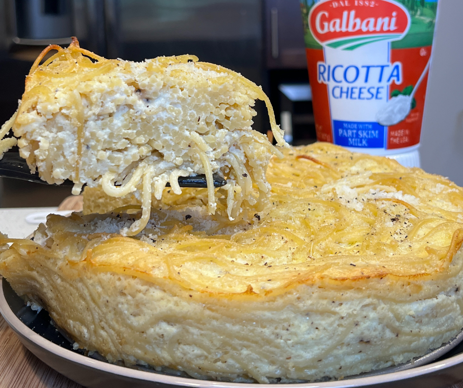 A pasta pie with a slice being lifted out