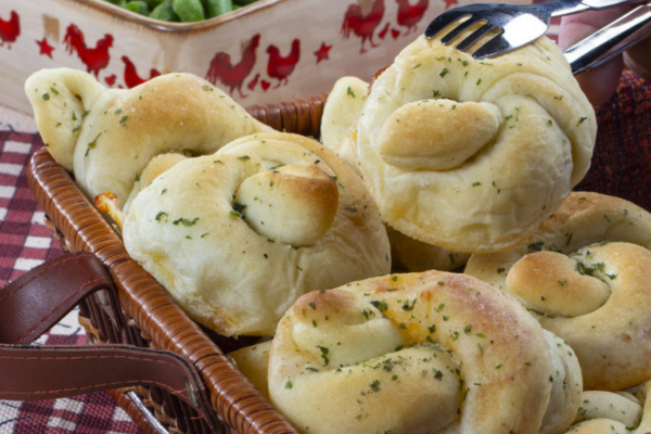 A basket filled with dinner rolls