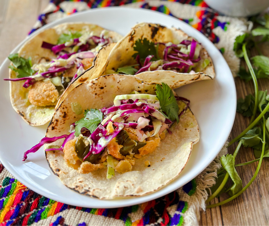 white plate with three tacos