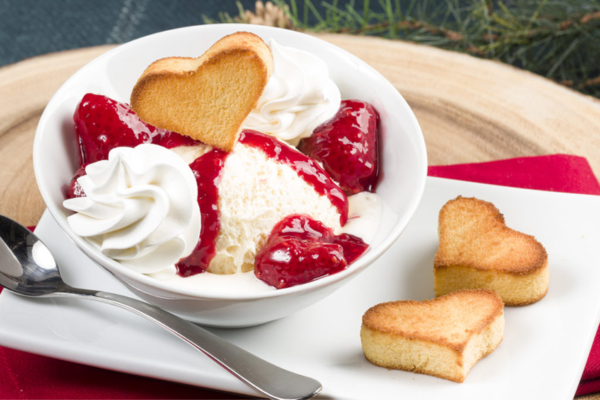 Hearty Berry Sundae Bowl with two heart cookies to the right and a spoon to the left