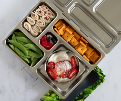 Metal lunchbox with various compartments