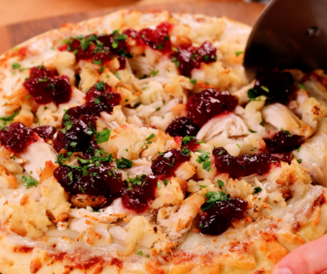 Pizza topped with cranberry sauce, turkey, and stuffing