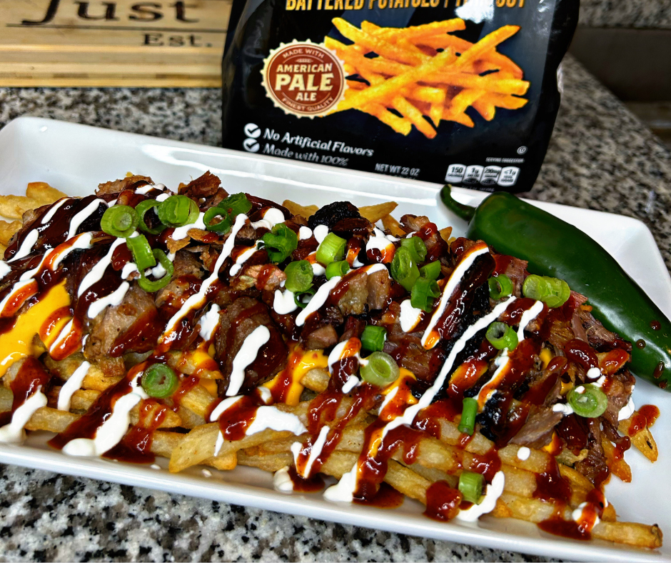 Close up shot of a plate of loaded BBQ fries