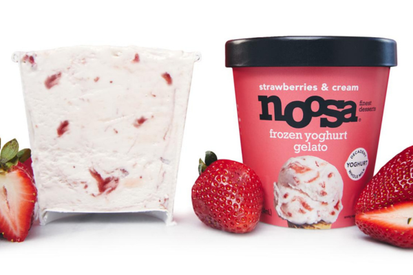 a direct shot of a carton of noosa strawberries and cream frozen yoghurt gelato