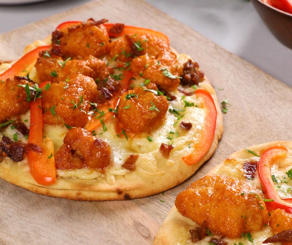 an orange chicken and bacon flatbread pizza