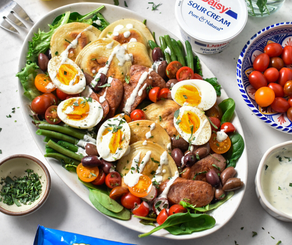 a plate of pierogi nicoise salad