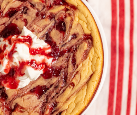 A white pan of raspberry cheesecake