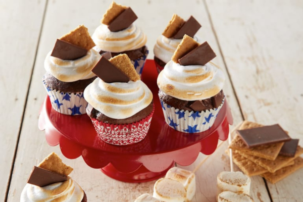 Direct shot of 5 S'mores Cupcakes with patriotic wrappers on top of a red tray