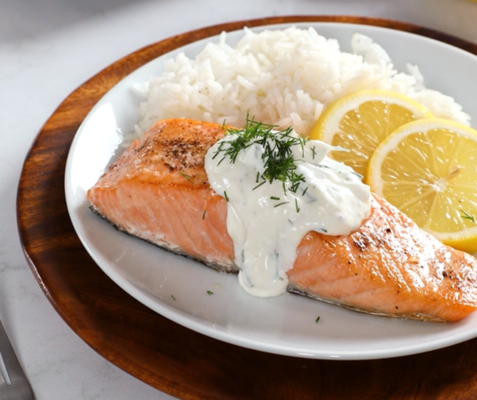 Salmon, white rice, and lemon on a plate