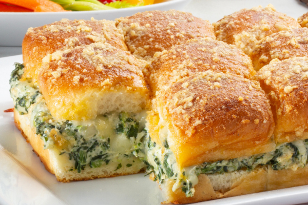 spinach and artichoke dip sliders on a plate