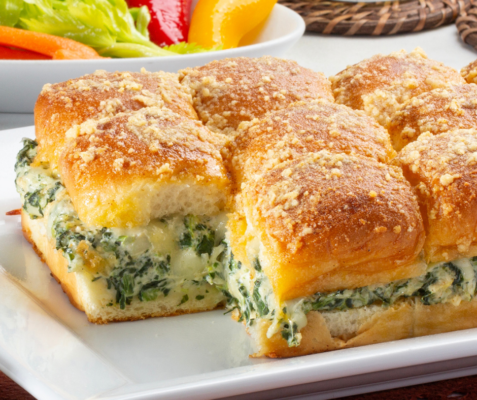 Slider buns with spinach and artichoke dip filling