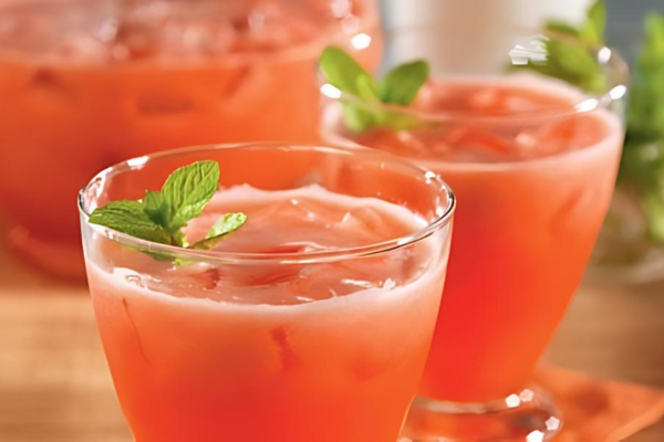 2 glasses of strawberry lemonade topped with a sprig of mint