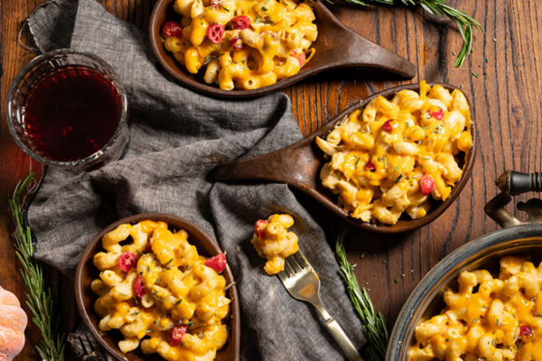 Wooden bowls filled with mac and cheese