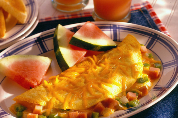 a Western omelet and watermelon on a plate