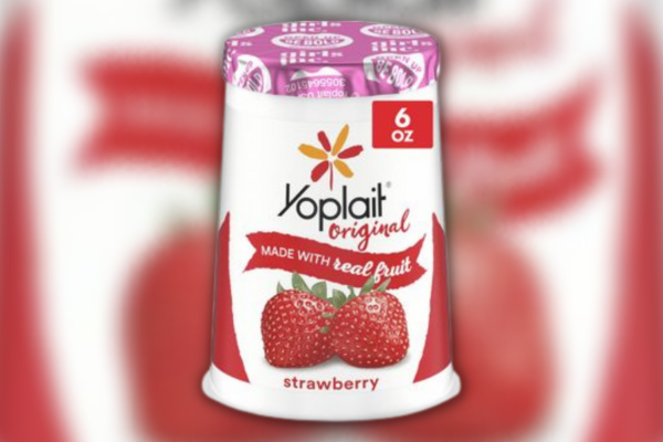 Direct, close up photo of yoplait strawberry single serve yogurt against a blurred background